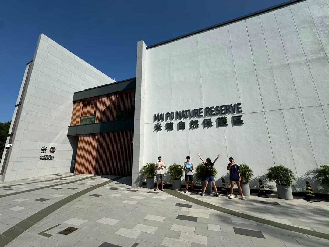 Mai Po Nature Reserve entrance building under a clear blue sky